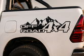 White truck with 'Off Road 4x4' decal on the back