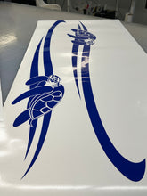 A set of two blue vinyl stickers with a turtle design and stripes, intended for use on vehicles such as boats and caravans.