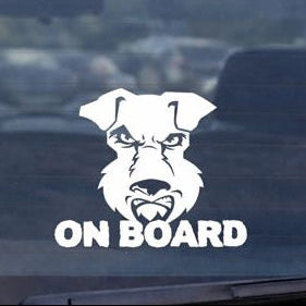 Car window with a dog-themed 'On Board' decal