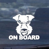 Car window with a dog-themed 'On Board' decal