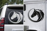 Horse head decal on the back of a vehicle and a trailer.
