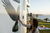 Large Australian Black Cockatoo bird decal applied to the side panel of a white motorhome caravan