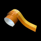 Roll of orange tape on a black background