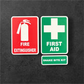 Set of three emergency stickers for vehicles or windows including fire extinguisher, first aid, and snake bite kit in red, white, and green colors.
