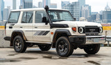 A Toyota Landcruiser with retro side body stripe stickers in beige, black, and orange colors.