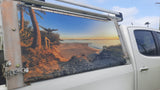 Mega Sticker Store custom vinyl decal featuring a beach sunset landscape applied to the side panel of a white 4WD ute.