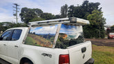 Mega Sticker Store custom vinyl wrap featuring a landscape photo on a white 4WD ute canopy for outdoor travel style.