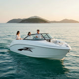 Mega Sticker Store black racing stripe decal applied to the side of a white motorboat cruising on calm water