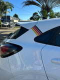 Mega Sticker Store retro pinstripe decal with orange, yellow, and black stripes applied to a white car rear pillar