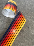 Mega Sticker Store retro pinstripe decal roll featuring vibrant orange, yellow, and brown stripes on glossy vinyl.