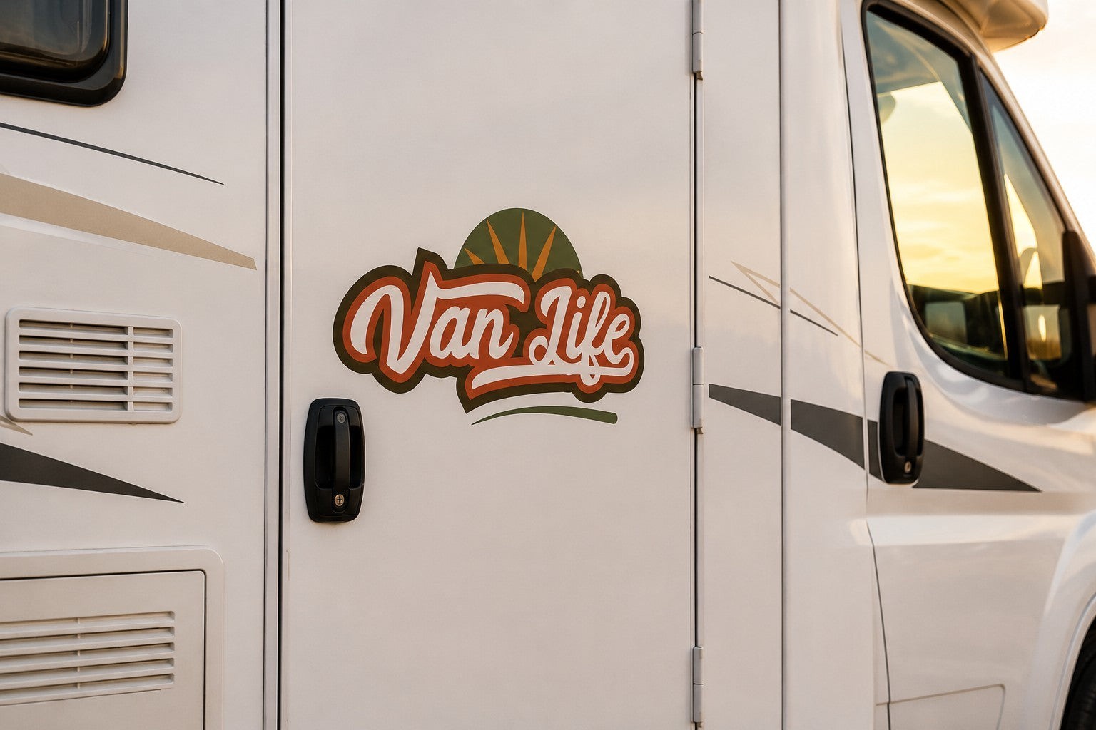 Mega Sticker Store Van Life Adventure vinyl decal applied to the white exterior door of a campervan at sunset.