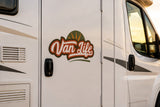 Mega Sticker Store Van Life Adventure vinyl decal applied to the white exterior door of a campervan at sunset.