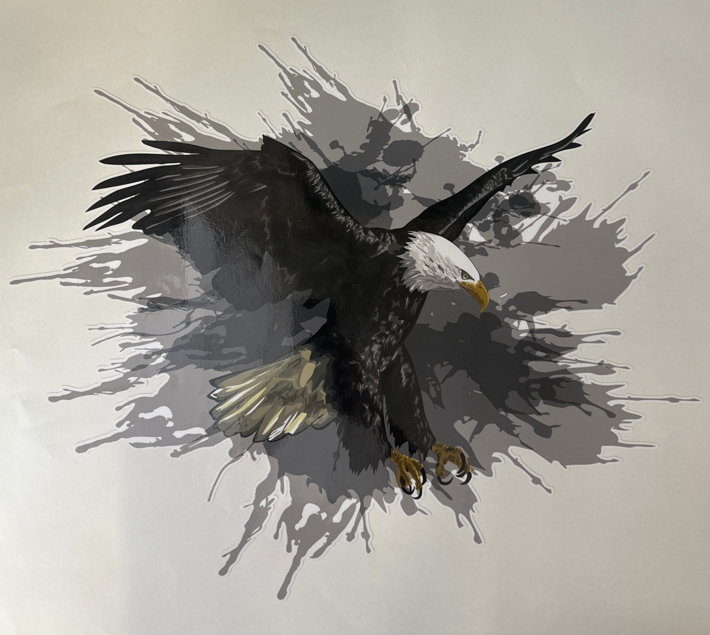 Beautiful decal featuring a white head eagle with wings expanded and claws out on a grey splatter background effect