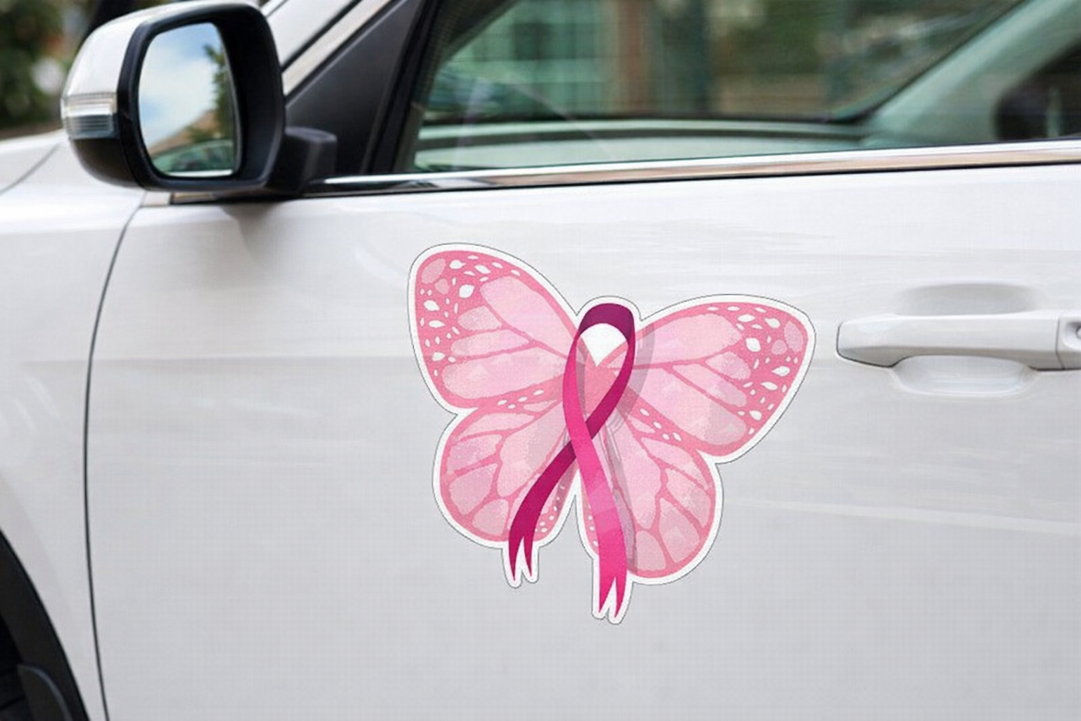 Pink butterfly with a pink ribbon on a car door, symbolizing breast cancer awareness.