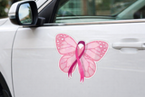 Pink butterfly with a pink ribbon on a car door, symbolizing breast cancer awareness.