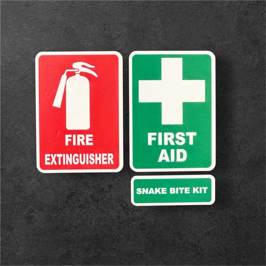 Set of three emergency stickers for vehicles or windows including fire extinguisher, first aid, and snake bite kit in red, white, and green colors.
