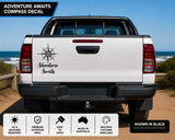 Adventure Awaits compass decal applied to the rear tailgate of a white 4WD ute