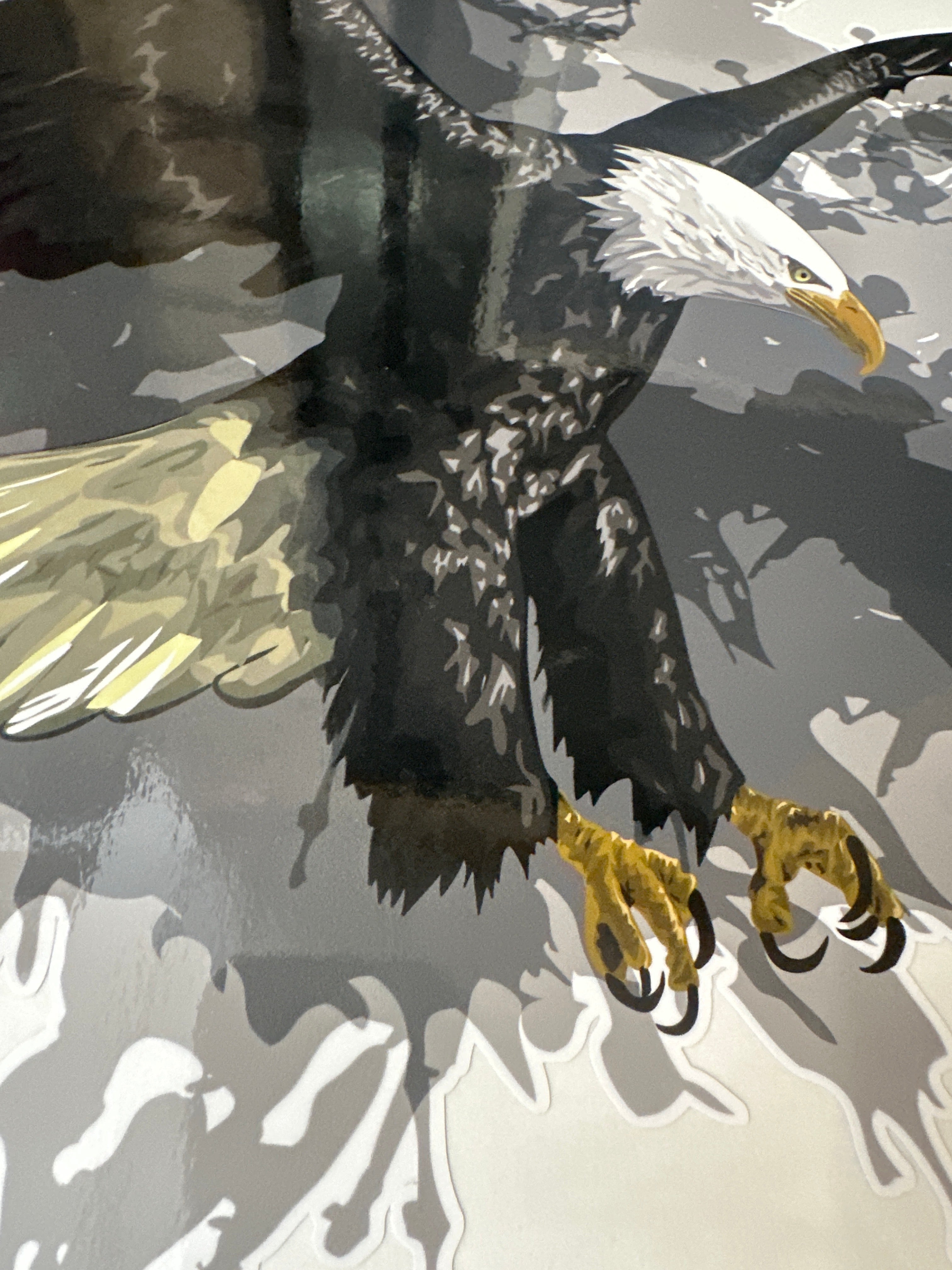 Illustration of a bald eagle with outstretched wings on a gray sticker decal for vehicle background