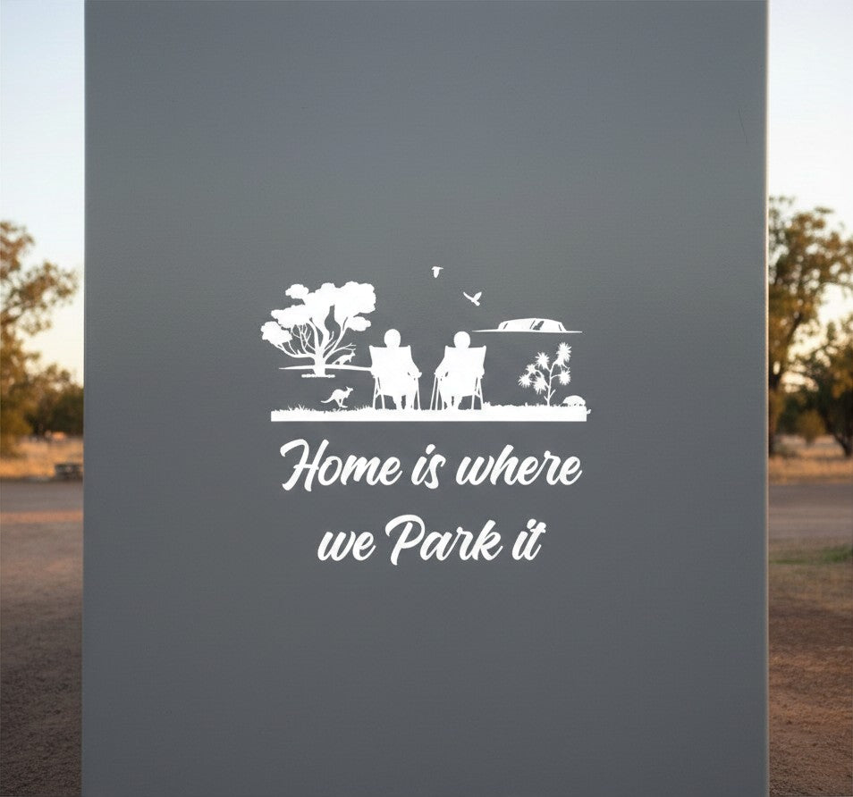 Mega Sticker Store white vinyl decal featuring a couple in chairs with Home is where we park it text for motorhomes
