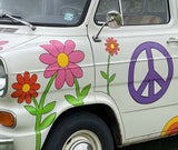 Mega Sticker Store retro flower and peace sign vinyl decals applied to the side of a white vintage camper van.