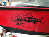 Mega Sticker Store large black shark vinyl decal applied to the red hull of a fishing boat for an aggressive look.