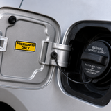 Premium 98 fuel identification sticker applied beside a vehicle fuel filler cap