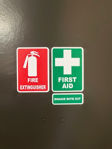 Set of three emergency stickers for vehicles or windows including fire extinguisher, first aid, and snake bite kit in red, white, and green colors.