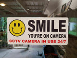 Smile You’re on Camera Sticker, CCTV Awareness Vinyl Decal for Glass Doors, Friendly Security Warning for Shops Offices Rentals